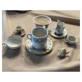 Tea cups, and saucers, some have chips