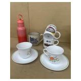 Coffee, mugs, and saucers