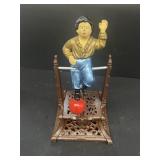 Cast-iron circus performer Bank
