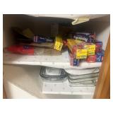 Dishes aluminum foil contents of cabinet