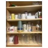 Glasses coffee mugs mis dishes in cabinet