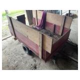 Farm wagon hooks to riding mower