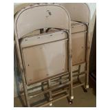 Card table with two metal chairs
