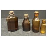 Small amber medicine bottles one is a Vicks