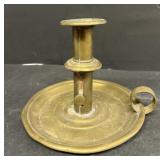 Early brass candle holder