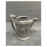 Vintage pitcher with duck handle and angel f