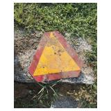 Slow moving vehicle sign