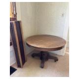 Antique oak pedestal table with four leaves