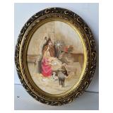 Manger scene on canvas oval frame