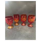 Orange, ruby red goblets