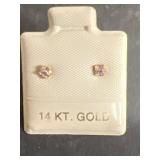 Earrings marked 14 K