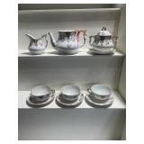 Tea, pot, cream, sugar, and cups and sauce
