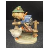 Hummel little boy on fence with duck