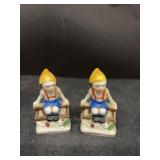 Porcelain Japan figures boy, sitting on fence