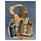 Over shoulder, gun, holster, and extra clips