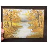 Painting of a fall scene and stream on board