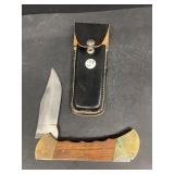 Large, single bladed pocket knife with sheath