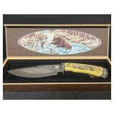Hunting knife with bear heavy carved on handle