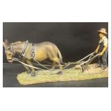 Horse farmer plowing field