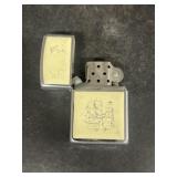 Zippo lighter with sailboat and lighthouse