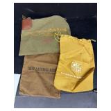 (4) Newcastle bank bags. One has a lock.