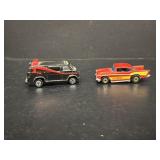 A team van and 1957 Chevy car