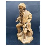 HAnd wooden carved man with violin