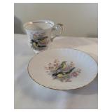 Queens bird of America, England, teacup, and