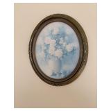 Oval frame print of flowers