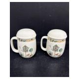 Salt and pepper shakers with birds and birdhouse