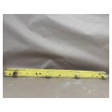 Old yellow paint over green paint wooden coat rack