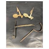Antique shell shutter, dogs, and hooks