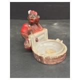 Black memorabilia ashtray does have damage on top