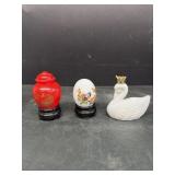 Perfume bottles and glass egg