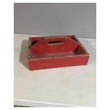 Red painted wooden carrier