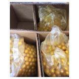 A lot of paint balls and a paintball gun