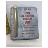 Rain gauge by Ford tractor sales and service of