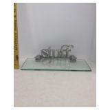 Glass shelf with stuff hanging