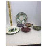 Group of saucers and blue house plate made in