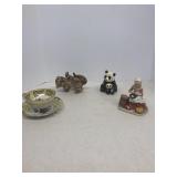 Panda figurine lion cub figurine woman peeling