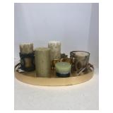 Gold colored tray with candles and candle holders