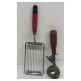Red handled ice cream scoop and cheese slicer