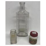 Medicine bottles and pork rind strip jar
