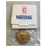 'NESTLE' COMMEMORATIVE COIN-CHECK OUT THE PIC'S