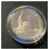 "1986" LIBERTY HALF DOLLAR COIN *IN PLASTIC HOLDER