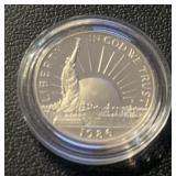 "1986" LIBERTY HALF DOLLAR COIN *IN PLASTIC HOLDER
