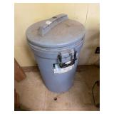 Trash can with misc golf stuff and cleaners