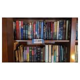 2 shelves of books, religious, novels,