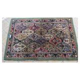 100% wool area rug, signs of wear, 92x62'