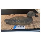 Well weathered decoy marked Victor